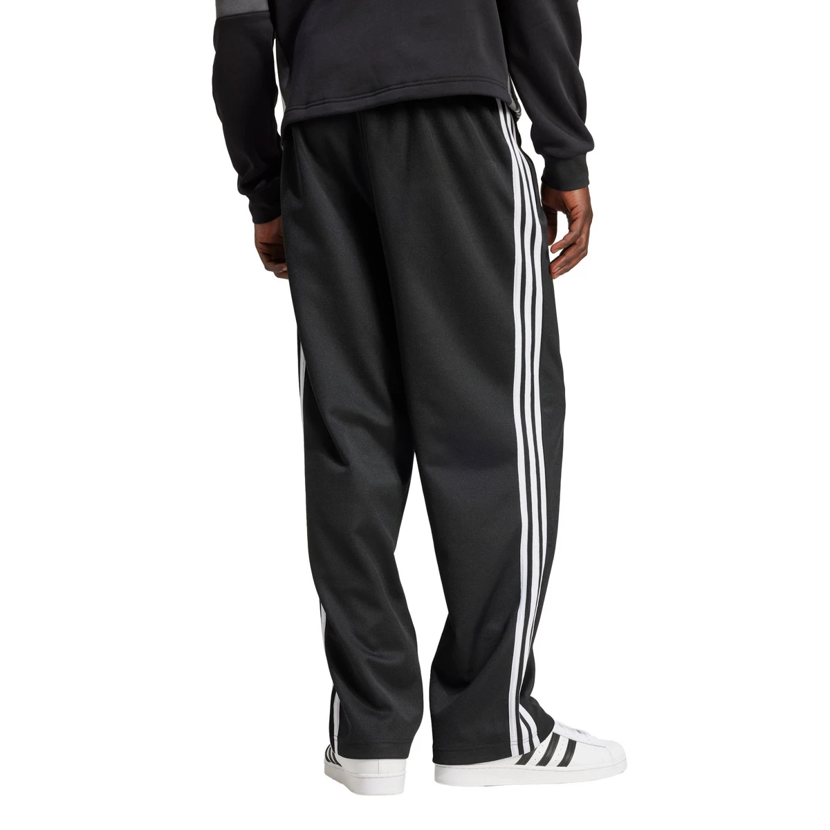 adidas - Długie spodnie Firebird Adicolor Baggy, Hombre, czarny, L