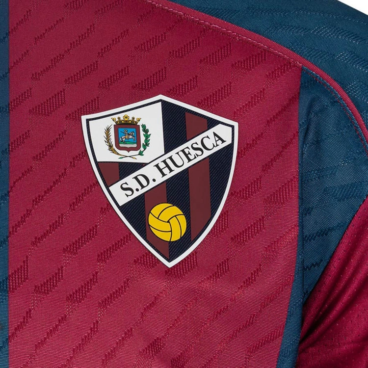 camiseta-soka-sd-huesca-primera-equipacion-nino-2026-2027-sdh-blue-sdh-red-2